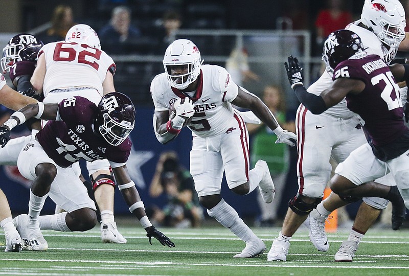 Arkansas running back Raheim Sanders (5) carries the ball, Saturday, September 23, 2022 during the second quarter of a football game at AT&T Stadium in Arlington, Texas. Visit nwaonline.com/220924Daily/ for today's photo gallery...(NWA Democrat-Gazette/Charlie Kaijo)