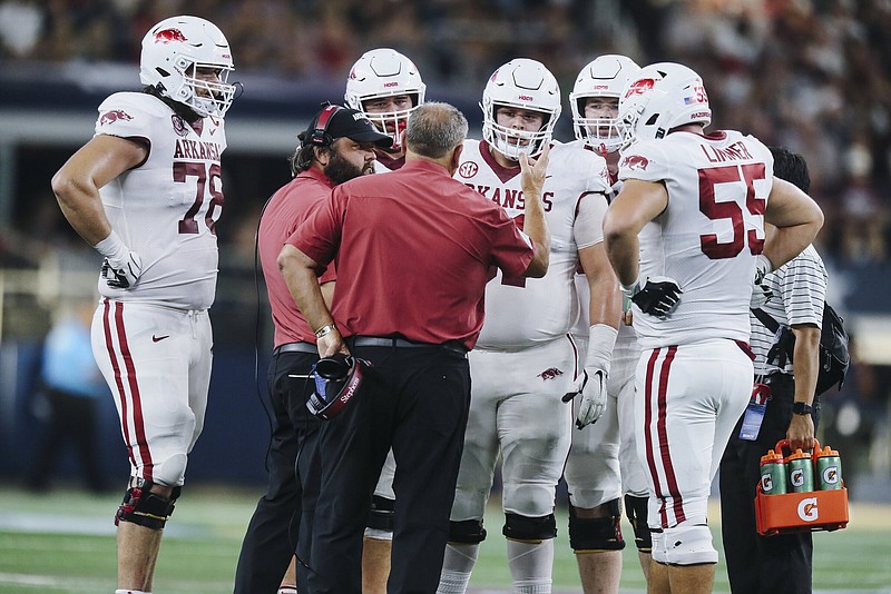 Arkansas head coach Sam Pittman talks to offensive lineman, Saturday, September 23, 2022 during the second quarter of a football game at AT&T Stadium in Arlington, Texas. Visit nwaonline.com/220924Daily/ for today's photo gallery...(NWA Democrat-Gazette/Charlie Kaijo)