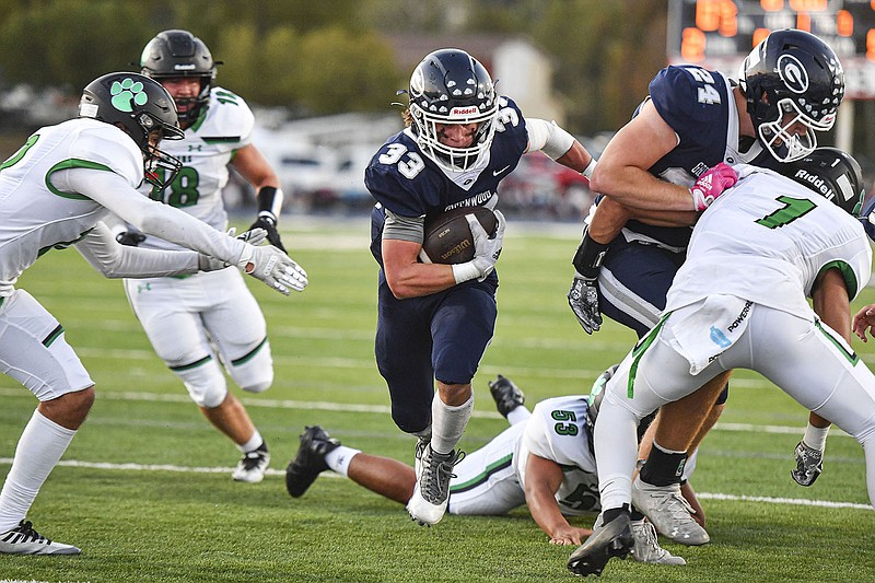 Jake Glover (33) of Greenwood scores a rushing touchdown, Friday, Sept. 23, 2022, during the first quarter against Van Buren at Smith-Robinson Stadium in Greenwood.  (NWA Democrat-Gazette/Hank Layton)