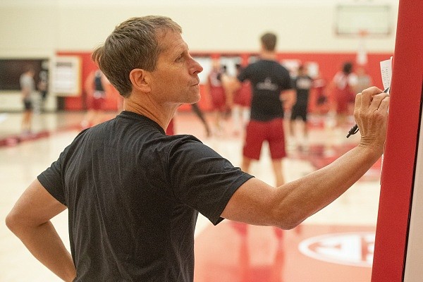 Arkansas head coach Eric Musselman writes notes on a piece of paper at the Razorbacks' first basketball practice of the 2022-23 season on Monday Sept. 26, 2022, in Fayetteville.