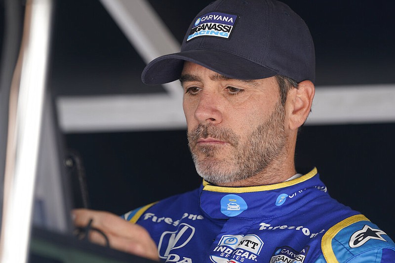 FILE - Jimmie Johnson sits in his pit box before the final practice for the Indianapolis 500 auto race at Indianapolis Motor Speedway, Friday, May 27, 2022, in Indianapolis. (AP/Darron Cummings, File)