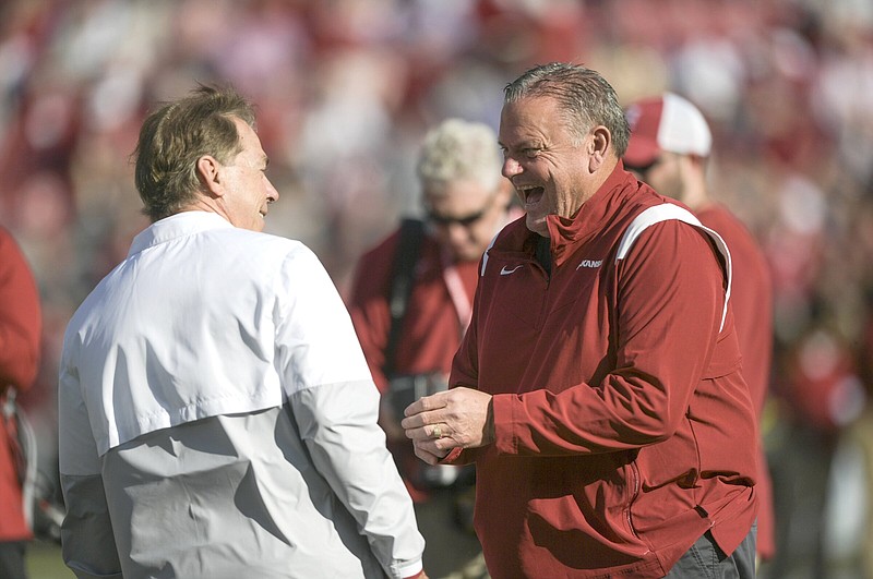 Alabama head coach Nick Saban chats with Arkansas head coach Sam Pittman, Saturday, November 20, 2021 before a football game at Bryant-Denny Stadium in Tuscaloosa, Ala. Check out nwaonline.com/211121Daily/ for today's photo gallery. .(NWA Democrat-Gazette/Charlie Kaijo)