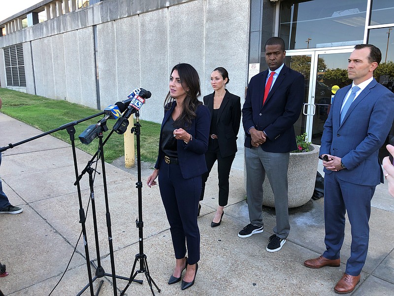 Attorney Alexandra Benevento, center, speaks with reporters during a news conference announcing a cheerleader abuse lawsuit filed in Tennessee on Tuesday, Sept. 27, 2022, in Memphis, Tenn. (AP Photo/Adrian Sainz)
