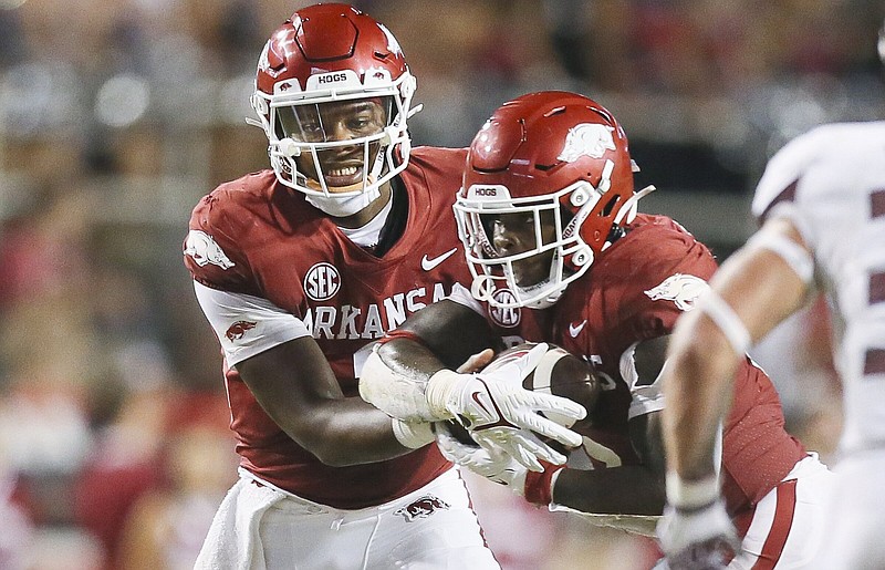 Arkansas quarterback KJ Jefferson (left) and running back Raheim Sanders have been the leaders of the Razorbacks’ offense this season. Getting more players involved in the offense is a goal. “Sometimes it gets hard to feed that many horses, man,” tight end Trey Knox said.
(NWA Democrat-Gazette/Charlie Kaijo)