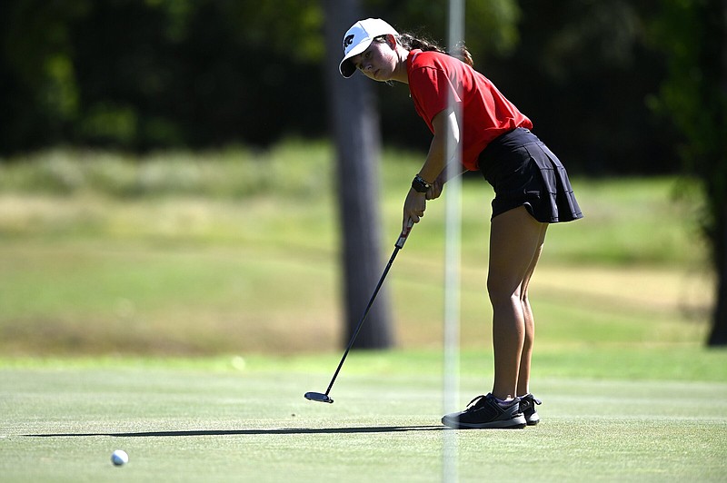 Cabot senior Emmerson Doyle follows the path of a putt Wednesday during the final round of the Class 6A girls state golf tournament at the Burns Park Championship Course in North Little Rock. Doyle shot an 11-over 153 to win the tournament by one stroke over Bentonville’s Lauren Pleiman. More photos at arkansasonline.com/929golf/.
(Arkansas Democrat-Gazette/Stephen Swofford)