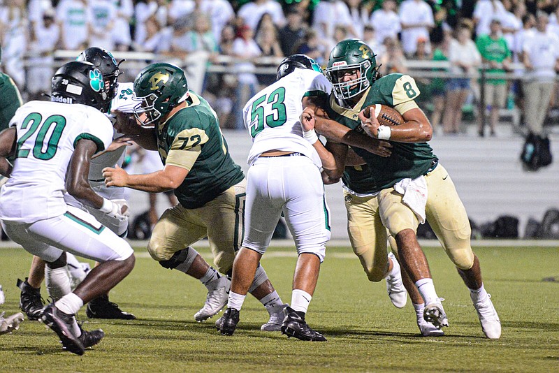 Alma quarterback Joe Trusty (right) runs the ball during the Airedales’ season opener Aug. 23 against Van Buren. Trusty and the Airedales (4-0) look to improve to 2-0 in the 5A-West Conference as they take on Farmington on Friday night.
(NWA Democrat-Gazette/Hank Layton)