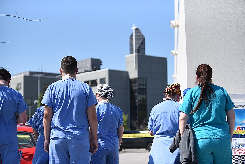 Hospital staff stand outside as local law enforcement respond to an active shooter Wednesday, Sept. 28, 2022 at the CHI St. Vincent North in Sherwood. See more photos at arkansasonline.com/929stvincent/..(Arkansas Democrat-Gazette/Staci Vandagriff)