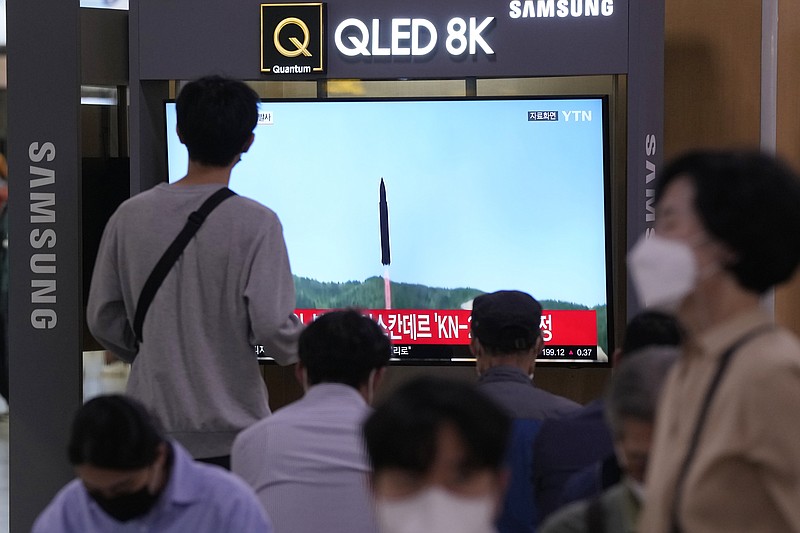 A TV screen shows a file image of a North Korean missile launch during a news program at the Seoul Railway Station in Seoul, South Korea, Wednesday, Sept. 28, 2022. North Korea fired a ballistic missile toward its eastern waters on Wednesday, South Korea's military said, a day before U.S. Vice President Kamala Harris is to visit the South. (AP Photo/Ahn Young-joon)