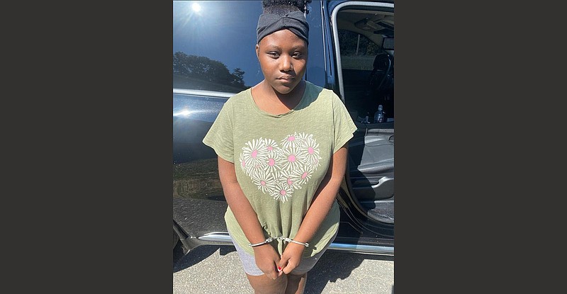 Renesha Washington, 18, a Watson Chapel High School student, is seen under arrest Wednesday on a probable-cause warrant for three counts of communicating a false alarm. 
(Special to The Commercial/Jefferson County Sheriff’s Office)