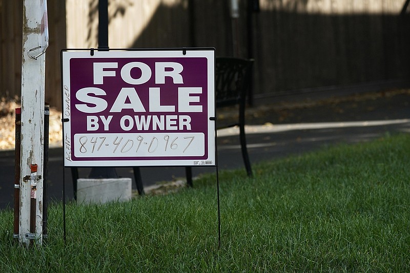 For sale by owner sign is displayed outside a house in Northbrook, Ill., last week. Average long-term U.S. mortgage rates rose this week for the sixth straight week, marking new highs not seen in 15 years.
(AP/Nam Y. Huh)