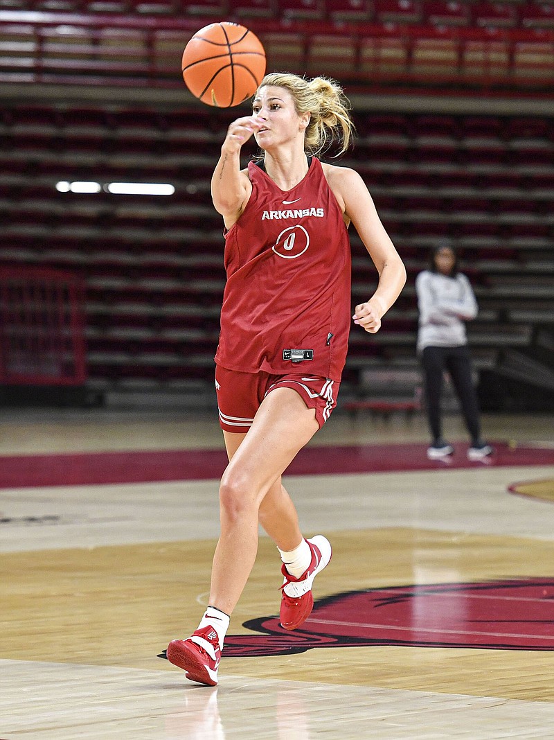 Arkansas guard Saylor Poffenbarger, who transferred from Connecticut, got to Fayetteville in January and said she’s had an easier time bonding with her teammates after watching them from the sidelines. “It brings a different perspective,” Poffenbarger said. “I think when you watch something, it’s easier to make it happen on the court because you’ve seen all the ways it goes.”
(NWA Democrat-Gazette/Hank Layton)