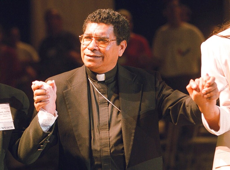 Bishop Carlos Ximenes Belo of East Timor, sings along with participants at the National Catholic Gathering for Jubilee Justice held on the UCLA Campus in Los Angeles, on July 17, 1999. (AP/Neil Jacobs, File)