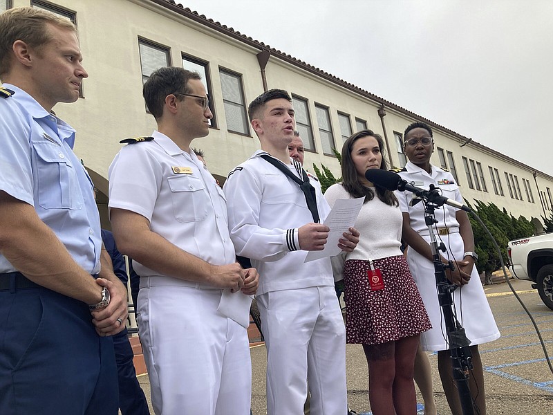 Navy sailor Ryan Sawyer Mays (center) reads a statement after his acquittal Friday in San Diego.
(AP/Elliot Spagat)