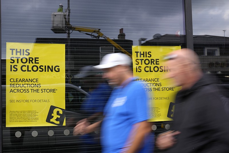 Pedestrians pass a closing down shop in London, on Sept. 23, 2022.(AP Photo/Kirsty Wigglesworth, File)
