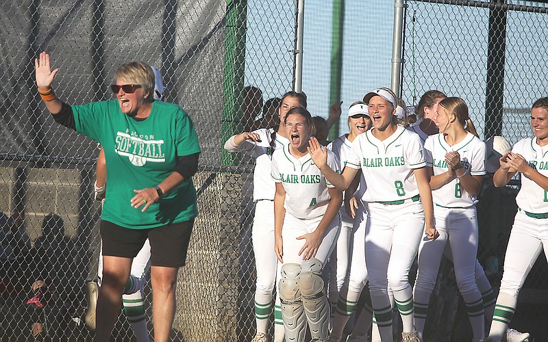 Blair Oaks coach Sharon Buschjost (left) and the Lady Falcon bench come out of the dugout to greet Baley Rackers (not pictured) after scoring a run during the third inning of Thursday’s game against Fatima at the Falcon Athletic Complex in Wardsville. (Greg Jackson/News Tribune)