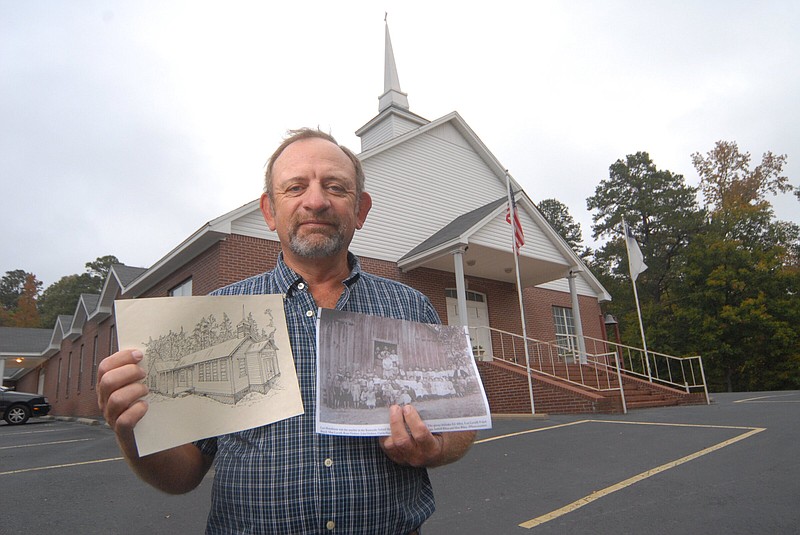 Eric Vinyard, a deacon at Kentucky Missionary Baptist Church near Benton, holds a rendering in 2012 of the congregation’s previous sanctuary and a photo from a previous era. The congregation is celebrating its bicentennial this weekend.
(File photo)