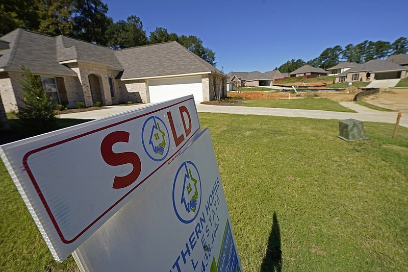 A “SOLD” sign decorates the lawn of a new house in Pearl, Miss., in 2021.
(AP/Rogelio V. Solis)