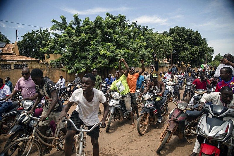 Young men chant slogans against the power of Lieutenant-Colonel Damiba, against France and pro-Russia, in Ouagadougou, Burkina Faso, Friday Sept. 30, 2022. (AP/Sophie Garcia)