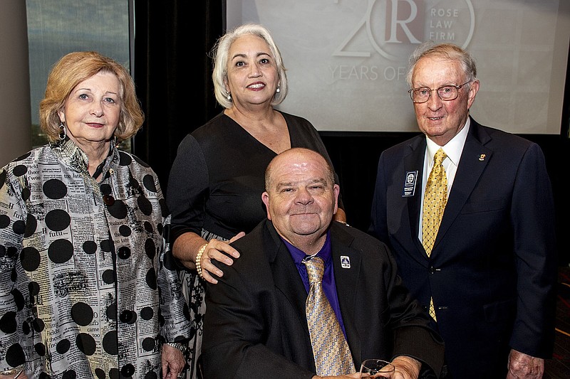 Nell Rockett, Christina and Chris (seated) Davis and Dave DeGraff on 9/22/2022 at World Services for the Blind 75th Anniversary Gala held at Robinson Center Ballroom. (Arkansas Democrat-Gazette/Cary Jenkins)