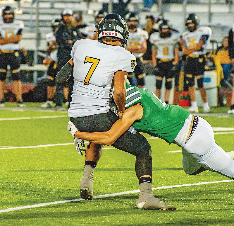 Alec Wieberg of Blair Oaks tackles Ty Ollison of Versailles during Friday night’s Homecoming game at the Falcon Athletic Complex in Wardsville. (Ken Barnes/News Tribune)