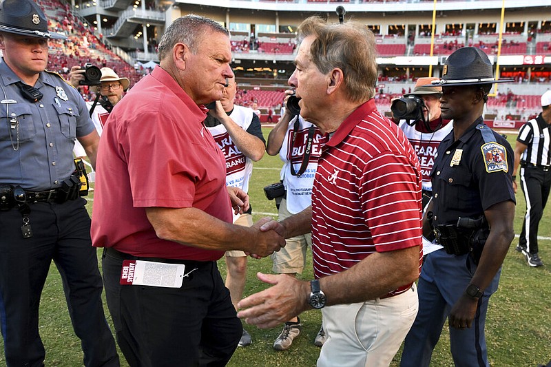 Arkansas coach Sam Pittman, left, shakes hands with Alabama coach Nick Saban after an NCAA college football game Saturday, Oct. 1, 2022, in Fayetteville, Ark. (AP Photo/Michael Woods)