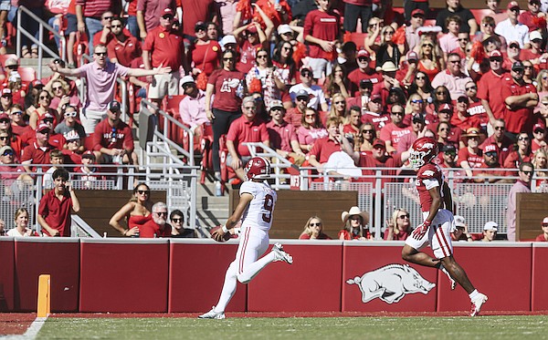 Alabama quarterback Bryce Young (9) scores, Saturday, October 1, 2022 during the first quarter of a football game at Donald W. Reynolds Razorback Stadium in Fayetteville.