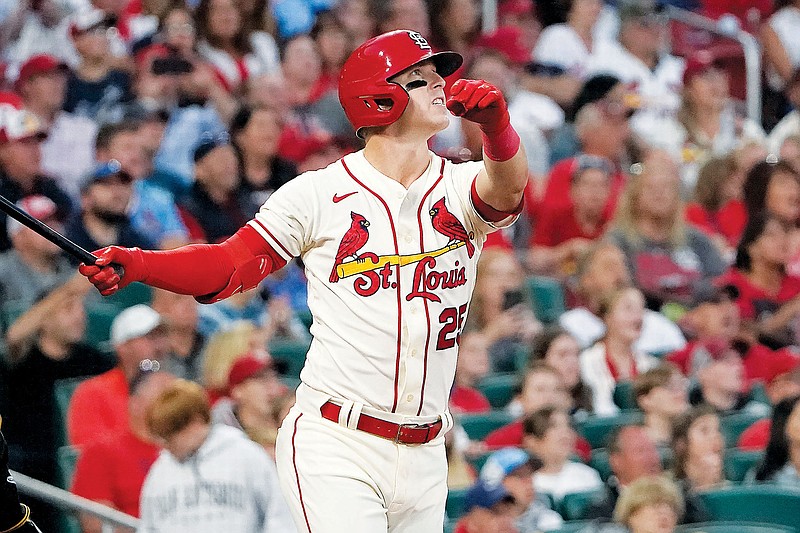 Corey Dickerson of the Cardinals watches his grand slam during the first inning of Saturday night’s game against the Pirates at Busch Stadium in St. Louis. (Associated Press)