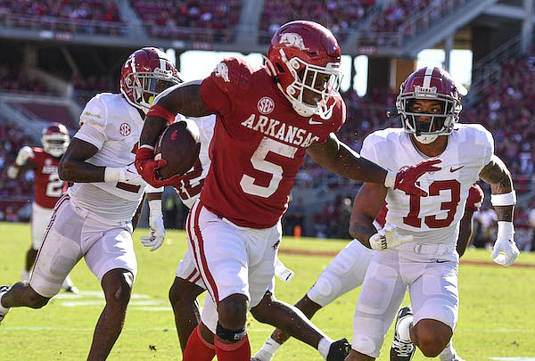 Arkansas running back Raheim Sanders (5) carries the ball, Saturday, Oct. 1, 2022, during the second quarter against Alabama at Donald W. Reynolds Razorback Stadium in Fayetteville.