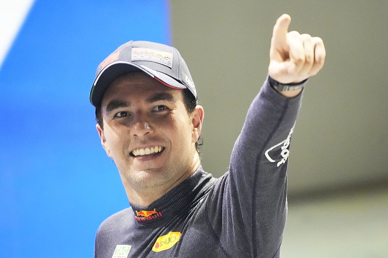 Sergio Perez celebrates Sunday after winning the Singapore Formula One Grand Prix in Singapore. (Associated Press)