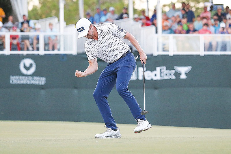 Mackenzie Hughes celebrates after sinking a putt Sunday to win the Sanderson Farms Championship in Jackson, Miss. (impact601.com via the Associated Press)