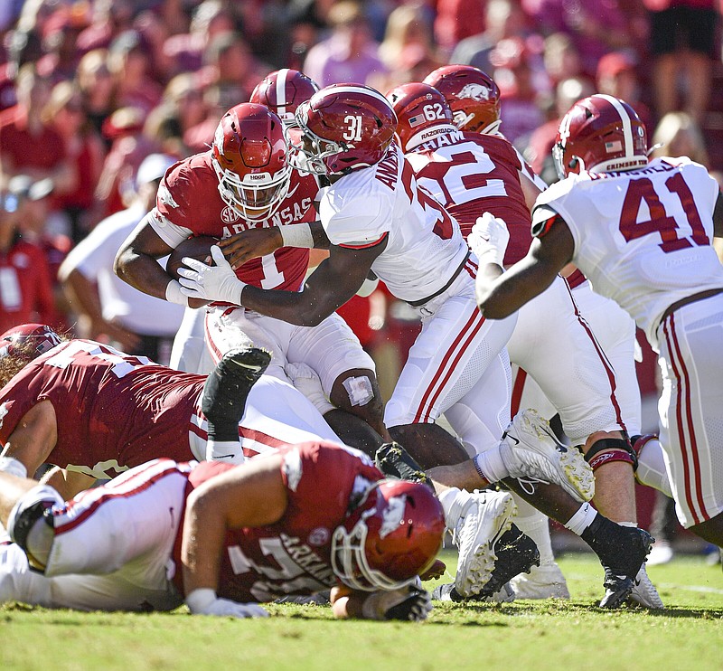 Arkansas quarterback KJ Jefferson (1) is tackled by Alabama linebacker Will Anderson Jr. (31), Saturday, Oct. 1, 2022, during the second quarter of the Razorbacks’ 49-26 loss at Donald W. Reynolds Razorback Stadium in Fayetteville. Visit nwaonline.com/221002Daily/ for today's photo gallery..(NWA Democrat-Gazette/Hank Layton)