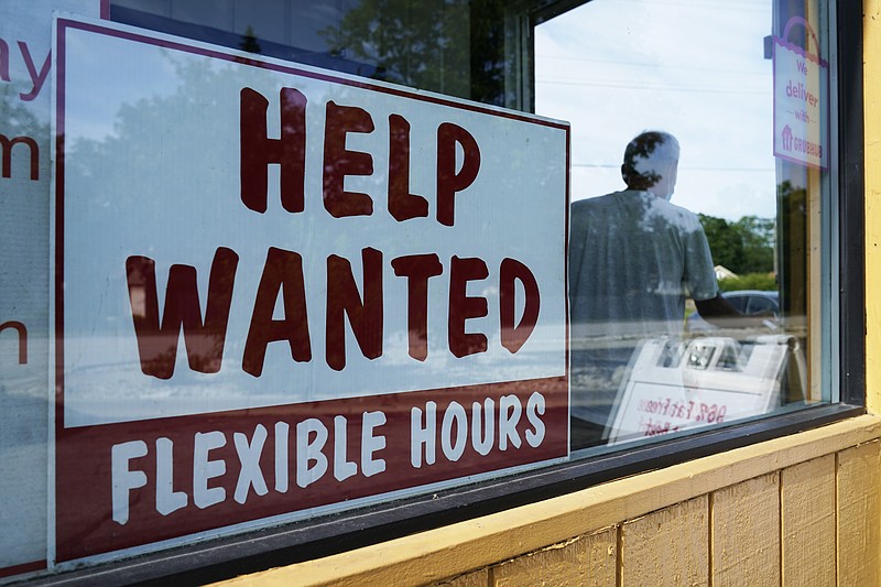 A help wanted sign is displayed in Deerfield, Ill., Wednesday, Sept. 21, 2022. (AP Photo/Nam Y. Huh)
