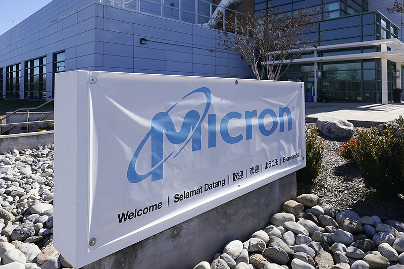 A sign marks the entrance of the Micron Technology automotive chip manufacturing plant on Feb. 11, 2022, in Manassas, Va.(AP Photo/Steve Helber, File)