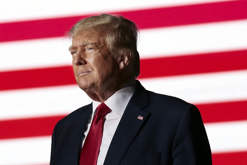Former President Donald Trump listens to applause from the crowd as he steps up to the podium at a rally Friday, Sept. 23, 2022, in Wilmington, N.C. (AP Photo/Chris Seward, File)
