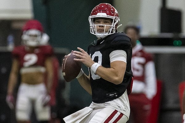 Arkansas quarterback Cade Fortin throws during practice Saturday, April 16, 2022, in Fayetteville.