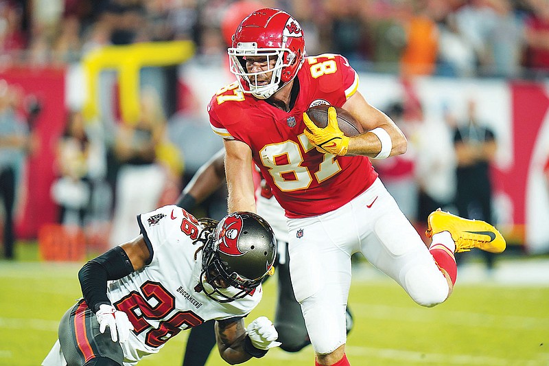 Chiefs tight end Travis Kelce scores a touchdown during Sunday night's game against the Buccaneers in Tampa, Fla. (Associated Press)