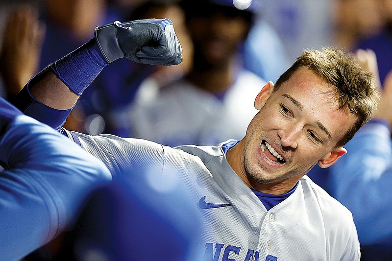 Drew Waters celebrates in the Royals dugout after hitting a three-run home run during the top of the 10th inning in Monday night’s game against the Guardians in Cleveland. (Associated Press)