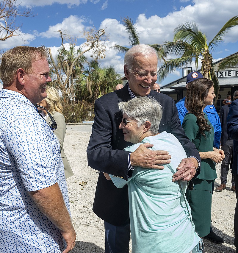 President Joe Biden shares an embrace Wednesday in Fort Myers, Fla., during his visit to survey storm-ravaged areas of the state. Biden was joined by Florida Gov. Ron DeSantis, who Biden said had done a “good job” dealing with the crisis, working “completely in lockstep” with the White House. More photos at arkansasonline.com/106ian/.
(The New York Times/Doug Mills)
