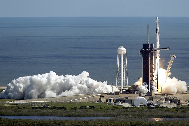 A SpaceX Falcon 9 rocket with astronauts lifts off Wednesday on Pad 39A at the Kennedy Space Center in Cape Canaveral, Fla., for a mission to the International Space Station. Video online arkansasonline.com/106spacex/.
(AP/Terry Renna)