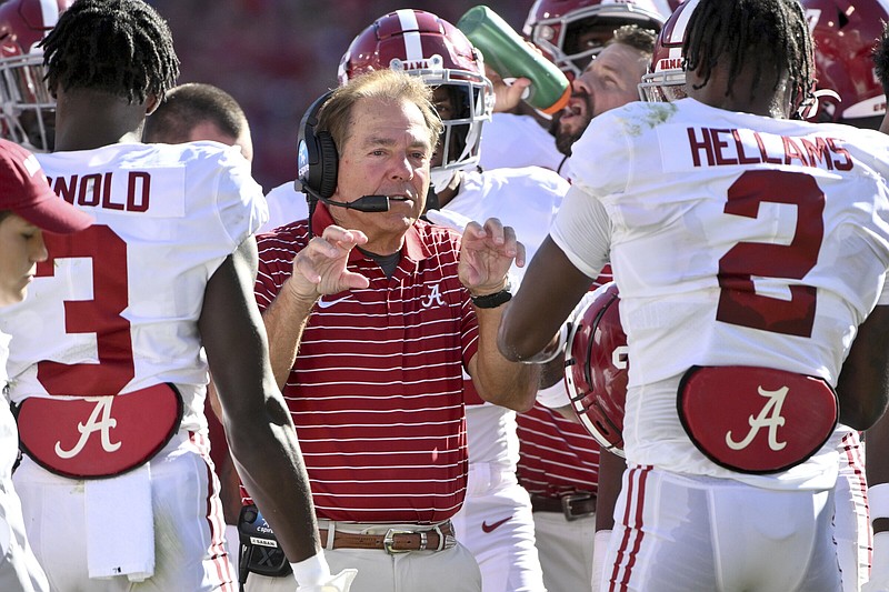 Alabama coach Nick Saban talks to his team during a time out against Arkansas during an NCAA college football game Saturday, Oct. 1, 2022, in Fayetteville, Ark. 
(AP Photo/Michael Woods)