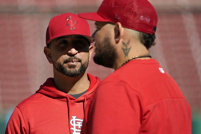 St. Louis Cardinals Manager Oliver Marmol (left) talks with catcher Yadier Molina during a workout Thursday at Busch Stadium in St. Louis. The Cardinals host the Philadelphia Phillies in the first game of a three-game National League wild-card series today. The winner will face the NL East champion Atlanta Braves in the division-series opener Tuesday.
(AP/Jeff Roberson)