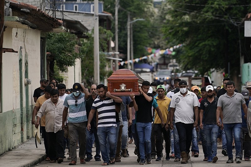 Residents carry the coffin of Wilmer Rojas on Thursday after he was killed in a mass shooting in San Miguel Totolapan, Mexico.
(AP/Eduardo Verdugo)