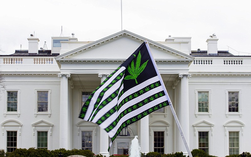 A demonstrator waves a marijuana flag outside the White House during a 2016 protest calling for the legalization of marijuana. President Joe Biden said his move Thursday to pardon thousands of Americans convicted in federal court of “simple possession” of marijuana will help thousands of people hamstrung by such prior convictions.
(AP)