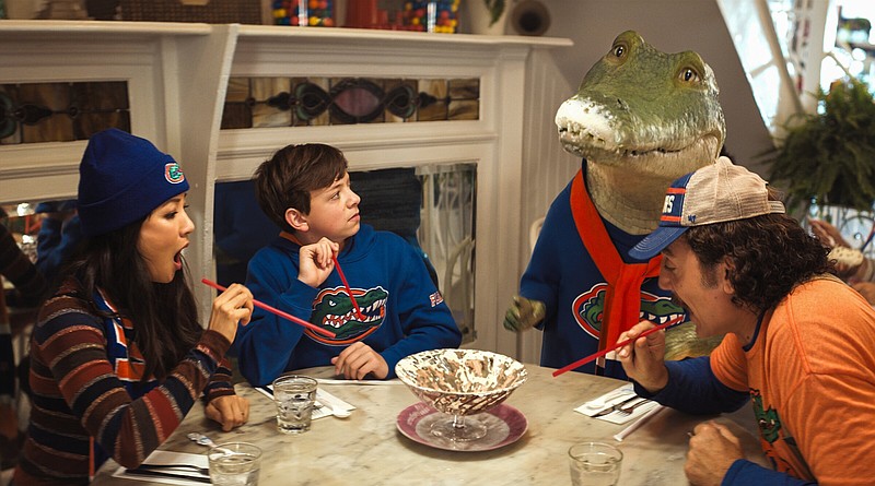 In “Lyle, Lyle Crocodile,” a children’s movie based on a popular children’s book, Mrs. Primm (Constance Wu) and her son (Winslow Fegley) apparently have no problems breaking bread with a singing crocodile (voiced by Shawn Mendes) and his erstwhile discoverer Hector P. Valenti (Javier Bardem).
