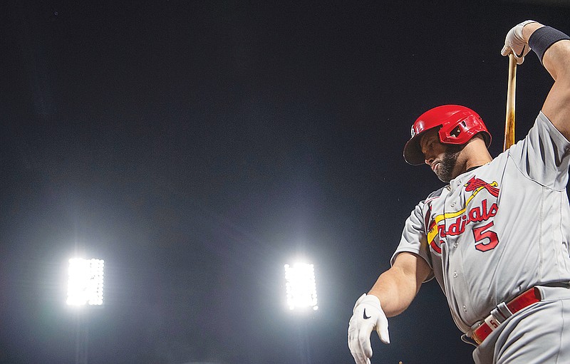 Albert Pujols of the Cardinals warms up before stepping up to the plate during Monday night's game against the Pirates in Pittsburgh. (Associated Press)