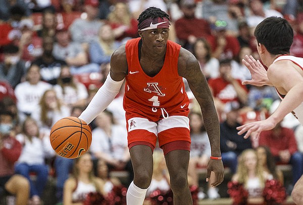 Arkansas guard Davonte Davis (4) dribbles the ball on Sunday, Oct. 17, 2021, during the first half of the Razorbacks' annual Red-White scrimmage at Barnhill Arena in Fayetteville.