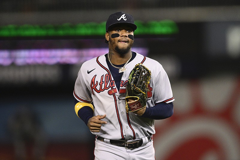 Atlanta Braves' Ronald Acuna Jr. runs to the dugout during a baseball game against the Washington Nationals, Wednesday, Sept. 28, 2022, in Washington. (AP Photo/Nick Wass)