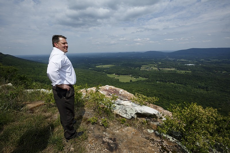 Staff Photo / Scenic Land Company President Duane Horton looks out from an overlook near the site of the planned Canyon Ridge Resort on Thursday, May 11, 2017, in Rising Fawn, Ga.