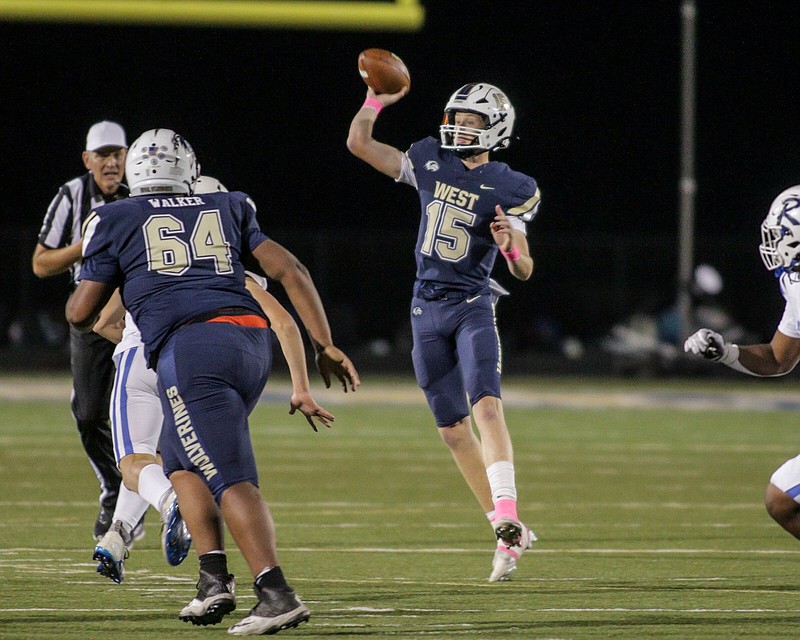 Bentonville West Wolverines Junior Jake Casey (15) pass on the run during the Rogers vs. Bentonville Westt football game, October 7, 2022, at Wolverines Stadium, Centerton, Arkansas (Special to NWA Democrat-Gazette/Brent Soule)