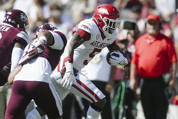 Arkansas running back Raheim Sanders (5) carries the ball in the red zone on Saturday, Oct. 8, 2022 during the first quarter of a football game at Davis Wade Stadium in Starkville, Miss.